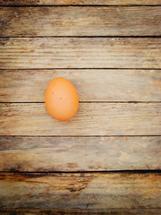 Egg On a wooden table. View from above.