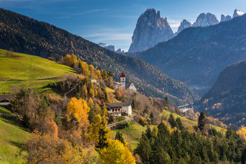 San Pietro di Laion is located at 1,210 m asl above the road from Chiusa to Ortisei The Baroque bulbous spire is the symbol of the village, located high above the Valgardena valley.

