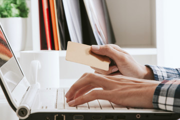 hands on computer keyboard with credit card, online shopping © carballo