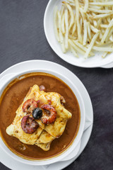 francesinha traditional meat cheese spicy sauce grilled sandwich