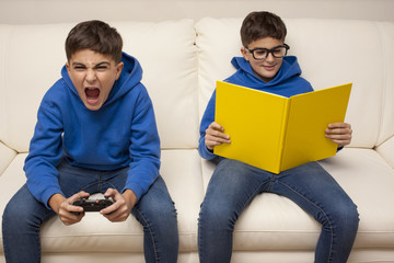 same child reads and plays with videogame