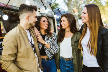 Group of friends enjoying time in the street.