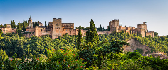 Famous Alhambra Royal Palace (UNESCO heritage) from the view point in front of the Alhambra hill - obrazy, fototapety, plakaty