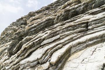 Layered rock formation folds on the Mediterranean island Crete, Greece