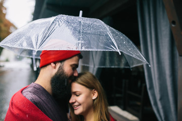 guy and girl under an umbrella