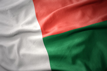 waving colorful flag of madagascar.