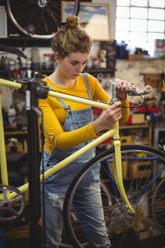 Mechanic repairing a bicycle handle bar