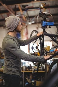 Mechanic examining a bicycle