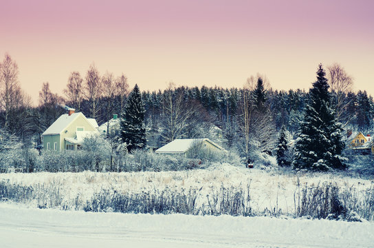 View of small swedish european town Soderhamn at pink sunset, winter seasonal background