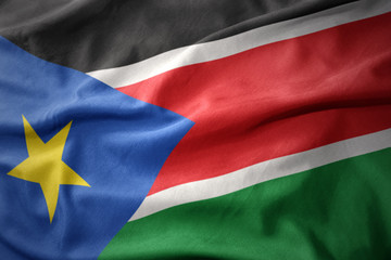 waving colorful flag of south sudan.