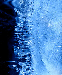 Micro air bubbles in the ice frozen during their movement to the water surface. 1 : 1 macro lens...