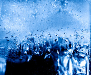 Micro air bubbles in the ice frozen during their movement to the water surface. 1 : 1 macro lens...