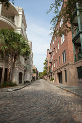 Fototapeta na wymiar Quiet cobblestone street near the waterfront, Charleston, South Carolina