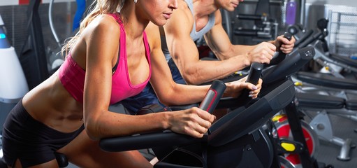 people on elliptical trainer - Powered by Adobe