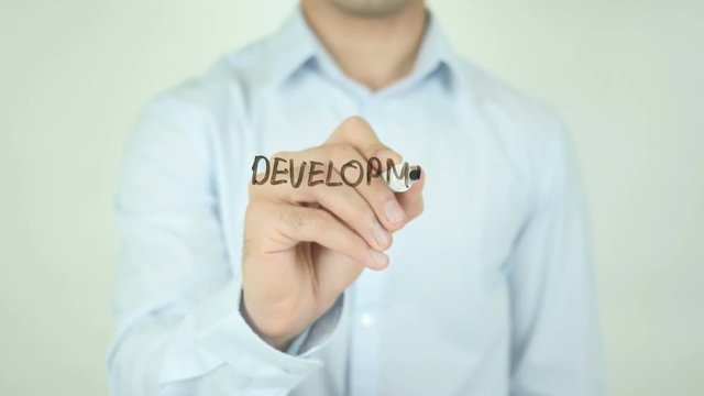 Development Plan, Man Writing on Screen