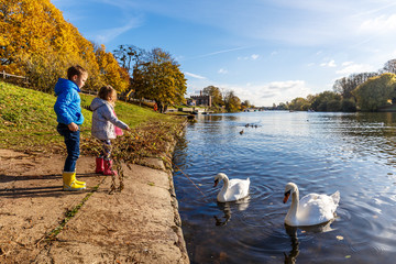 Fototapeta premium Family on river Thames in autumn