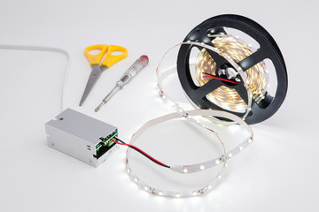 Coil luminous LED strip light and voltage transformer.