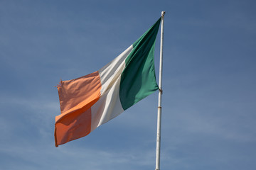 Italian flag on a deep blue sky