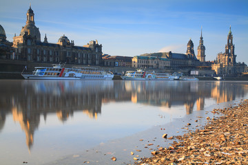 Skyline of Dresden with Elbe river, passenger ships and In background the Frauenkirche at sunrise