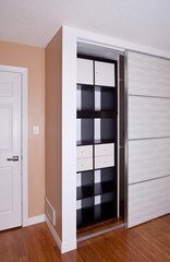 Built-in closet with sliding door shelving storage organization