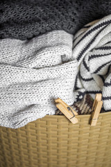 Laundry, warm clothes in the hamper