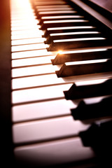 Electronic piano keyboard in the shade with shine elevated view © Davizro Photography