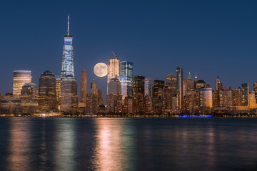 Perigee full moon over the skyscrapers of lower Manhattan-New Yo