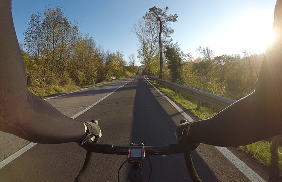 Enjoying a racing bicycle ride in Chianti region, Tuscany in autumn season. Personal perspective