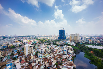 Ho Chi Minh city (or Saigon) skyline, Vietnam. Ho Chi Minh city (aka Saigon) is the largest city and economic center in Vietnam with population around 10 million people.