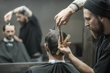 Doing haircut in barbershop