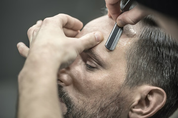 Trimming hair in barbershop