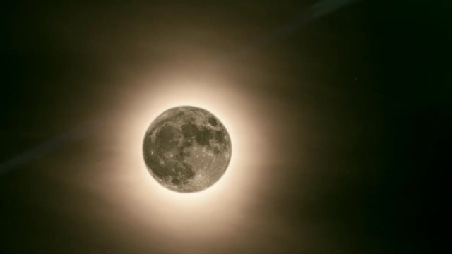 Animation of moon with halo moving from backward to forward, 