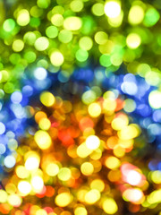 Christmas light bokeh background yellow, blue and green color.