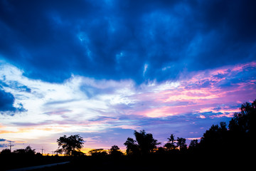 Silhouette of dramatic sunset and sunrise sky