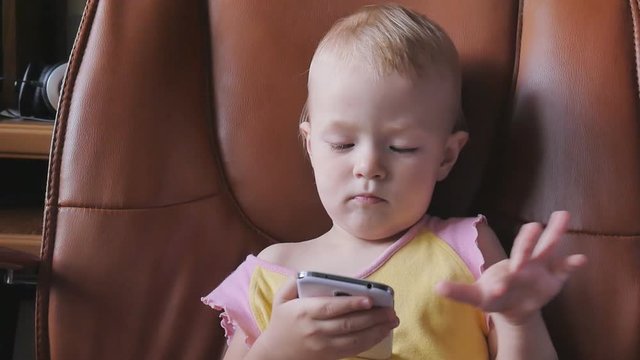 child playing with smart phone