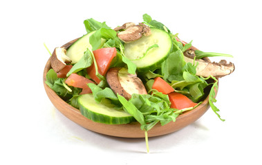 Fresh arugula salad on plate