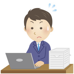 仕事に追われる男性