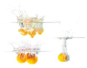 Fototapeta na wymiar Fresh orange falling and splashing into water. 