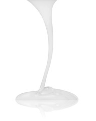 white cream flowing down isolated on a white background