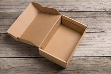 Cardboard box on a  wooden background