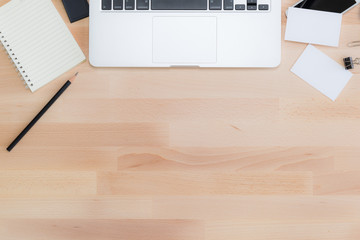 Naklejka premium Office table with notepad, computer, pencil and business cards.