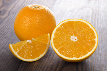 fresh orange fruit on wooden table
