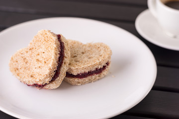 Fototapeta na wymiar Sweet sandwiches in heart shape for Valentines day