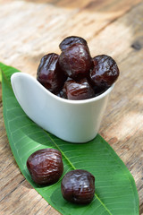 Red date - sugar preserved fruit on wood background