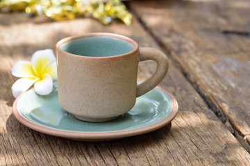 Empty coffee green cup on old wooden table