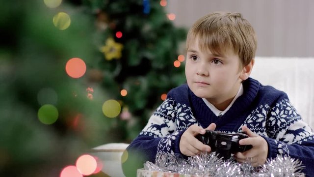 young boy playing playstation