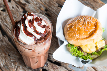 Ice chocolate with whipped cream on table