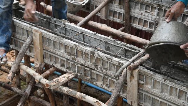 Concrete pouring during commercial concreting floors of buildings in construction(Commercial Building)