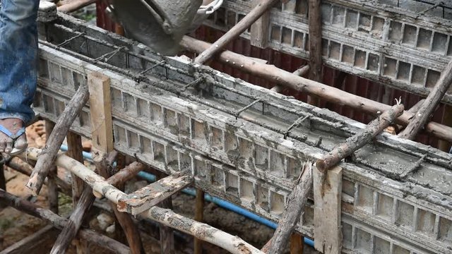 Concrete pouring during commercial concreting floors of buildings in construction(Commercial Building)