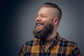 Fototapeta premium Laughing bearded male in yellow shirt.